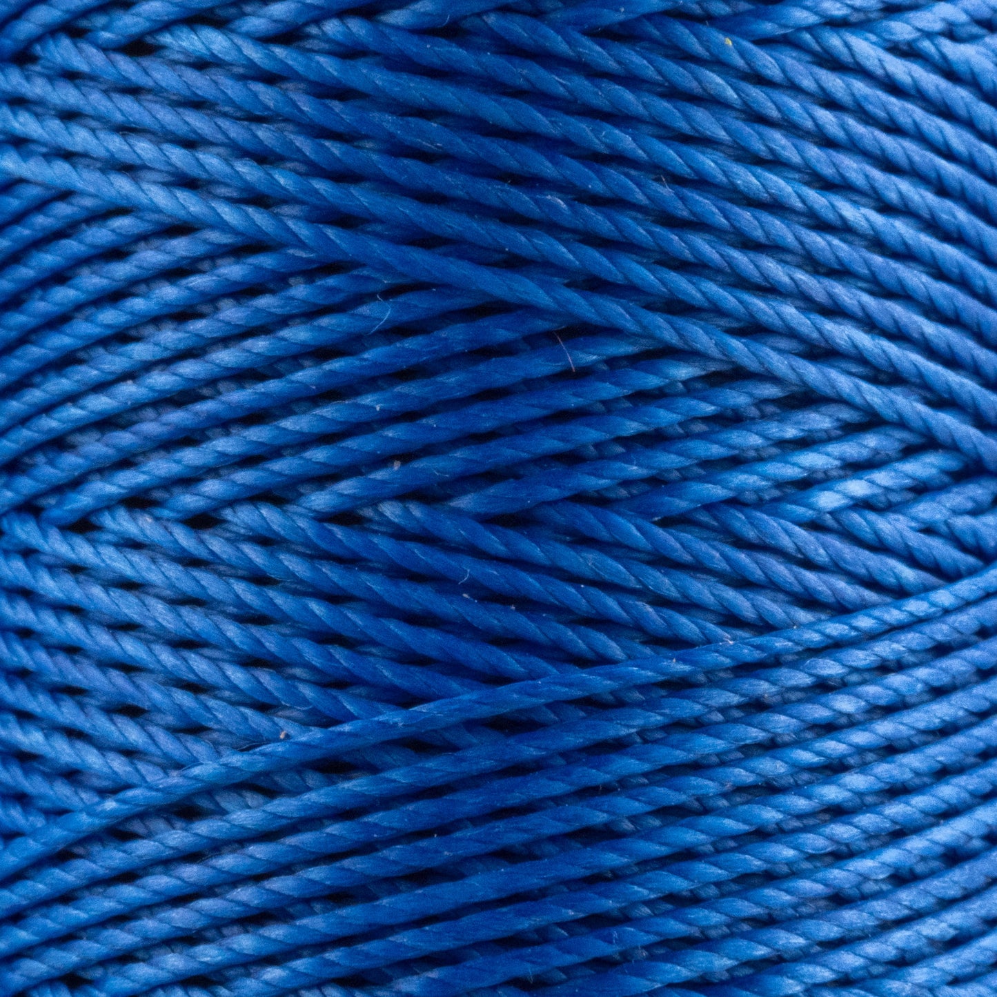 Hilo de poliéster encerado